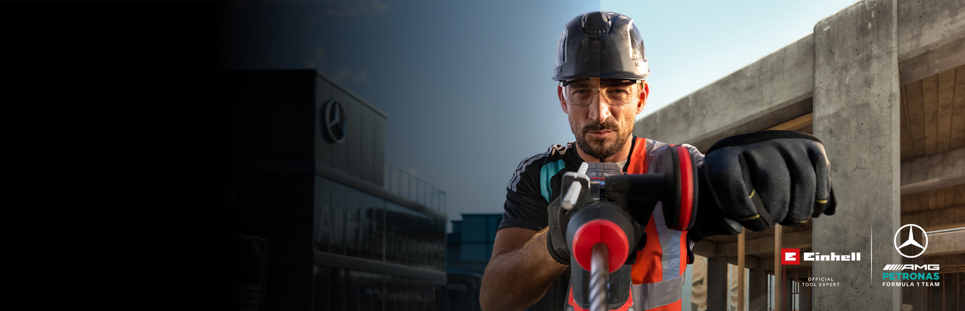 Een monteur in beschermende kleding die met elektrisch gereedschap aan het boren is op een bouwplaats.